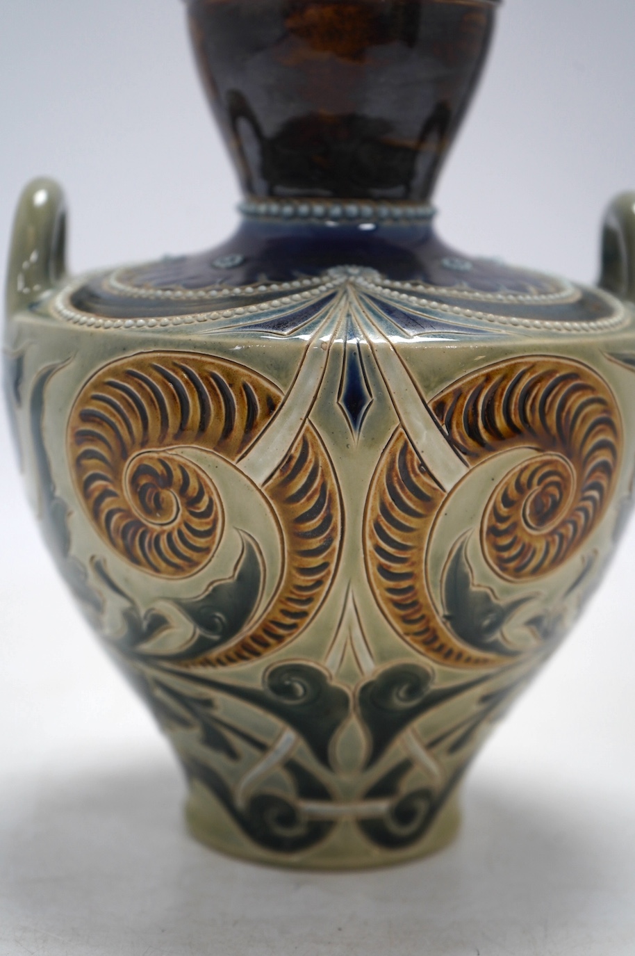 A Doulton Lambeth vase by Stormer, monogrammed and dated 1887, 20.5cm high. Condition - good